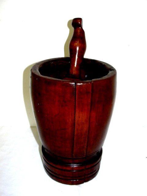 Mid 19th. C. Wood Moyar & Pestle: This is a wooden mortar and pestle from the mid.19th century. It is 8.5 inches tall. The mortar is nicely turned with a distinct foot. The pestle is also well turned. Condition crack from the shrinkin