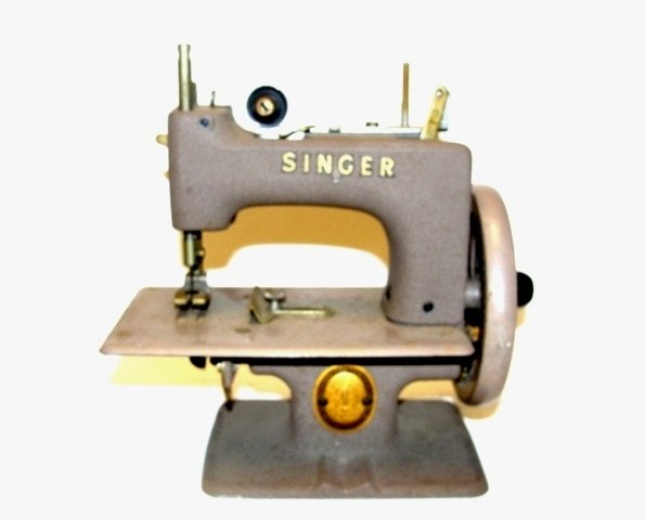 Singer Childs Toy Sewing Machine In Case: Tan-ish color, in good condition. 6 1/2'' x 6'' x 4''