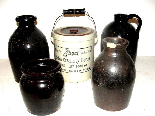 Collection Of Five Stoneware Crocks & Jugs: Including one 7'' tall Hazel butter adv. Lidded jar. Smallest 6'' tallest 8''. Condition minor chips, tight hairline on one. ''Betty S. Horton Estate''