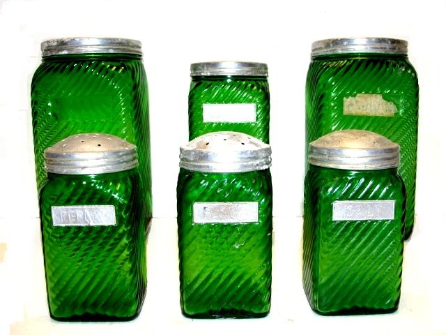 Collection Of Green & Clear Juice Bottles: Including 5 green bottles & two clear, impressed with Juice, Water and measurements. Condition all good, missing one lid, some lid's with minor scuff marks etc. 9 1/2'' tall.