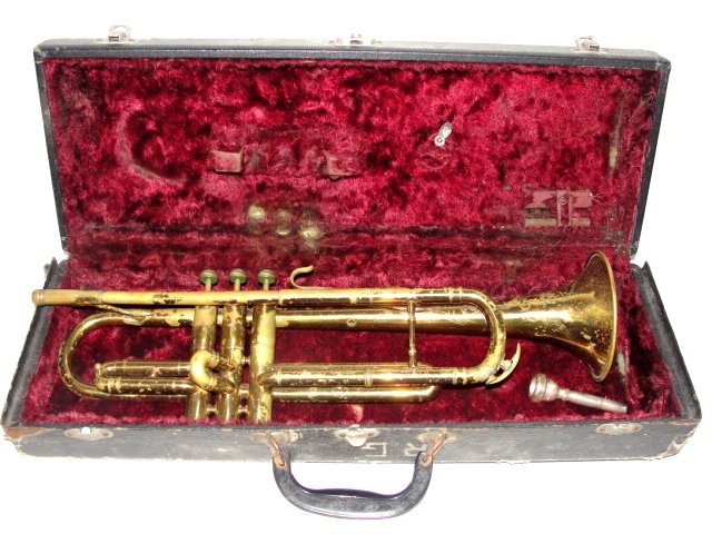 Trumpet Elkhart Indiana Stamped On Body: Condition well used, appears ok from visual look. Needs restoration, case has must odor from being stored in basement. Case worn.
