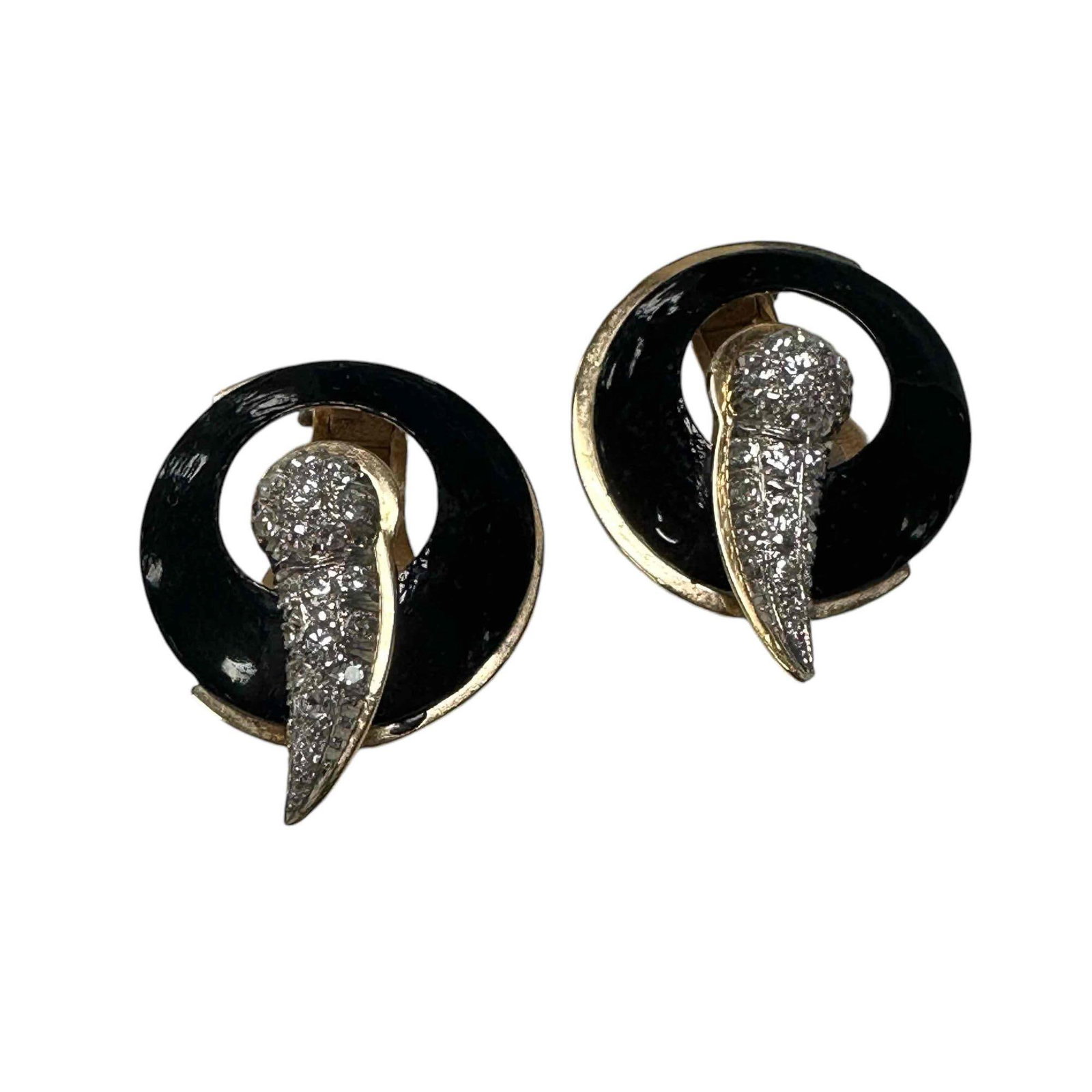 Black Enamel and Diamond Earrings: Black enamel and diamond clip-on earrings comprised with a black enamel open circle with pave-set single-cut diamond accents, 36 equaling approximately 0.54 carats, F-G color and VS1-VS2 clarity. Stam