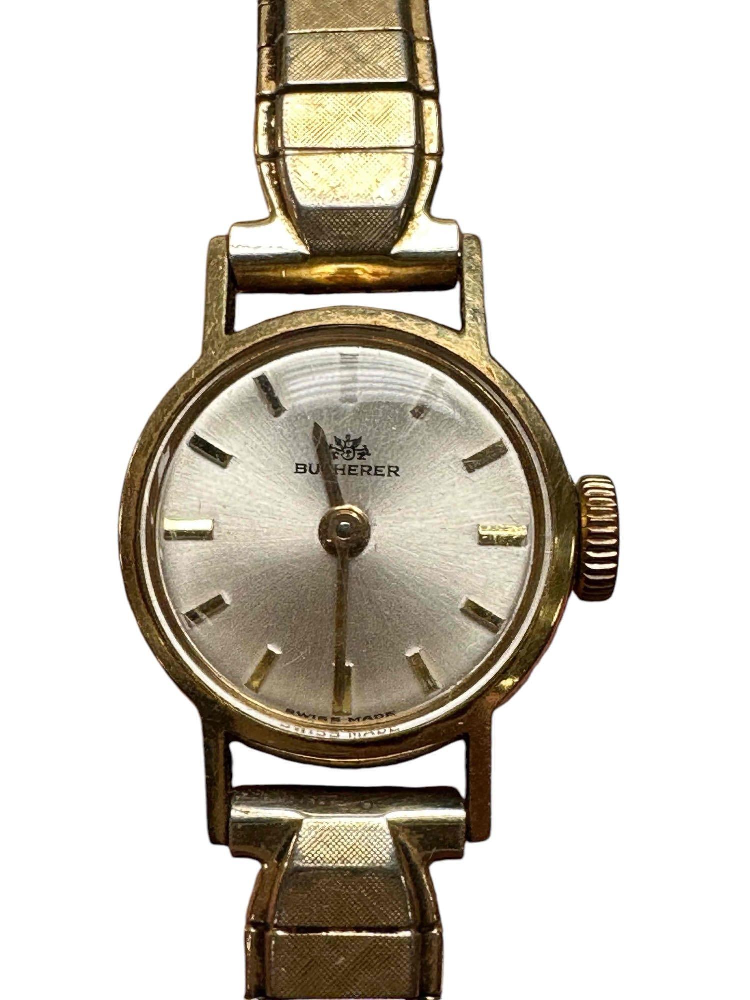 Vintage Bucherer 18k Yellow Ladies Gold Watch: A fine 18 karat yellow gold case ladies wrist watch with a steal and gold filled band. Stamped on back .750 18kt numbered 3146 as shown. Currently working and light use and wear as shown, see photos