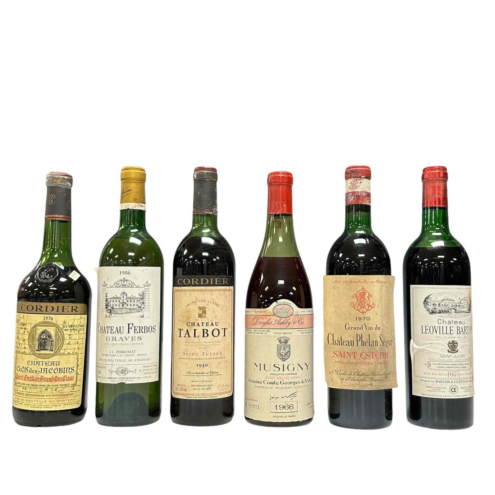 Six (6) Collectible Vintage French Wine Bottles: Including 1966 Vintage labeled MUSIGNY Domaine Comte Georges de Vogue, 1986 Chateau Ferbos GRAVES, Chateau Leoville Barton 1975, Cordier 1980 Chateau TALBOT, 1970 Grand Vil du Chateau Phelan Segur and