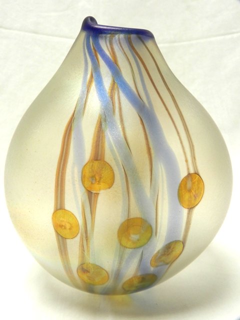 Nick Del Matto Art Glass Vase: Signed Nick Del Matto ovid belly vase with blue iridescent moderniest rim, streaming in body of glass with a assembly of yellow un bloomed style bulbs. High quality art glass. Signed and dated as show