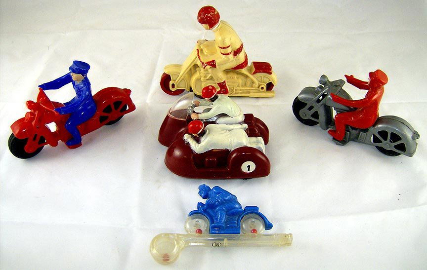 Lot of 5 Hard Plastic Motorcycle Toys: Circa 1950's. Hubley and other makers. 1 bike with unusual windup mech. All complete and original. Excellent condition.