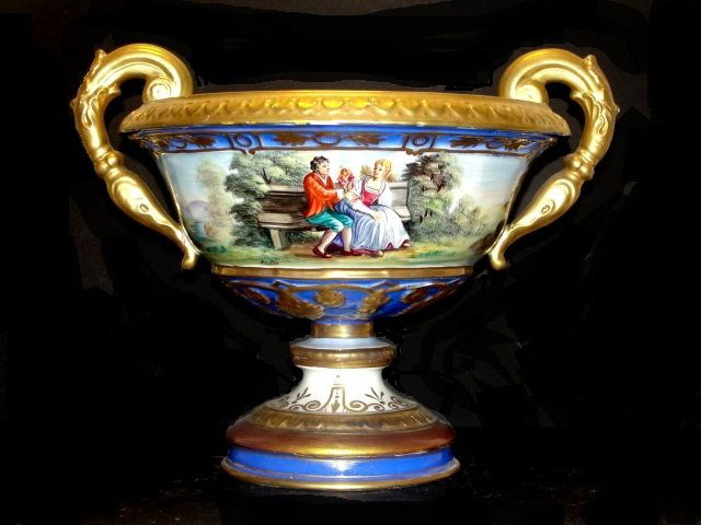 Continental Hand Painted Scenic Center Bowl: Having double serpent head handles, heavy gilt accents, with scenes of two romantic couple sitting on bench, other of remote castle on hill. Condition overall good, having couple area's of gilt missin