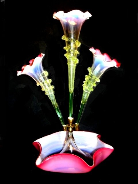 Victorian Three Flute Cranberry Epergne: Ca.1870-90, with fluted edge's. This is a stunning original antique Victorian epergne table centre piece in Vaseline and cranberry glass. Condition very good no chips. 18'' tall base 11'' dia.