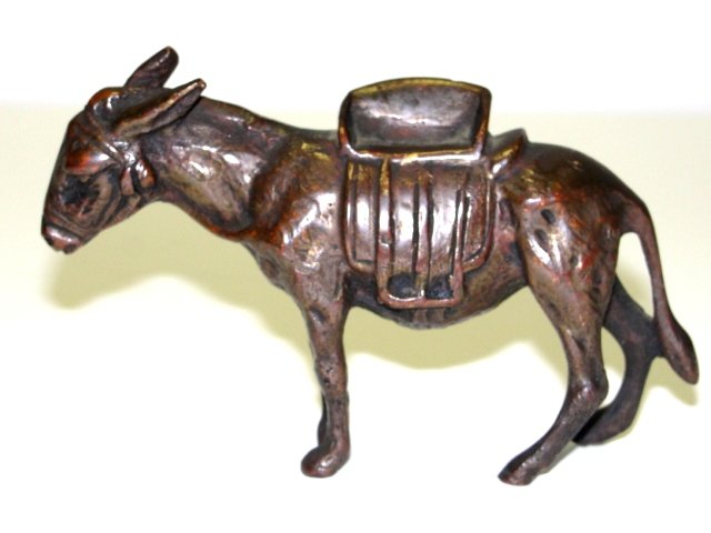Bronze Figure Of Burrow With Saddle Ca. 1900: Solid bronze burrow / donkey with side saddle. Probably Austrian unmarked. Condition good, nice patina. 3'' x 4 1/2'' x 1 1/4''