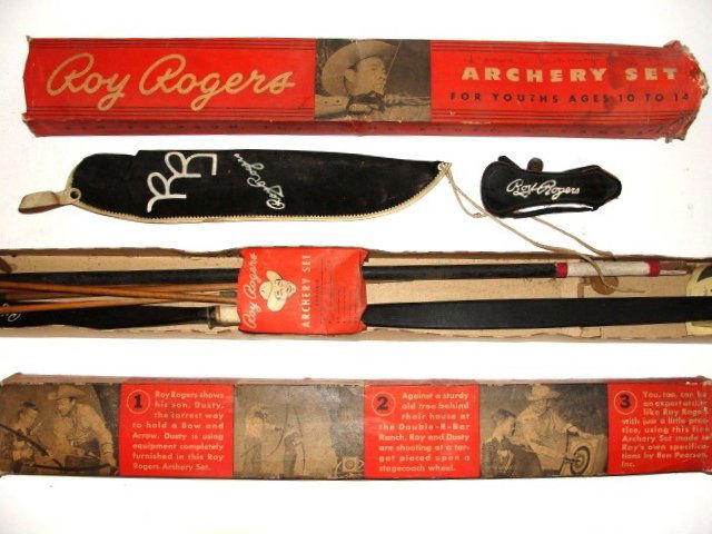 Roy Rodgers Toy Archery Set In Original Box: Rare to find these with original box. Roy Rogers Archery Set made by Ben Pearson. Inc. Pine Bluff, Arkansas. The box is the original and measures approx 4 1/2 feet. The bow & archery set that was orig