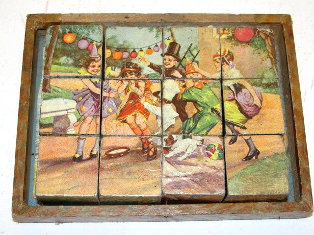 Victorian Children's Puzzle Lithograph Blocks: Twelve Lithographed paper on wooden cubes, featuring delightful children playing scenes. The cubes turn to form six different puzzles, 3 puzzle guides are all present, having only half of original box