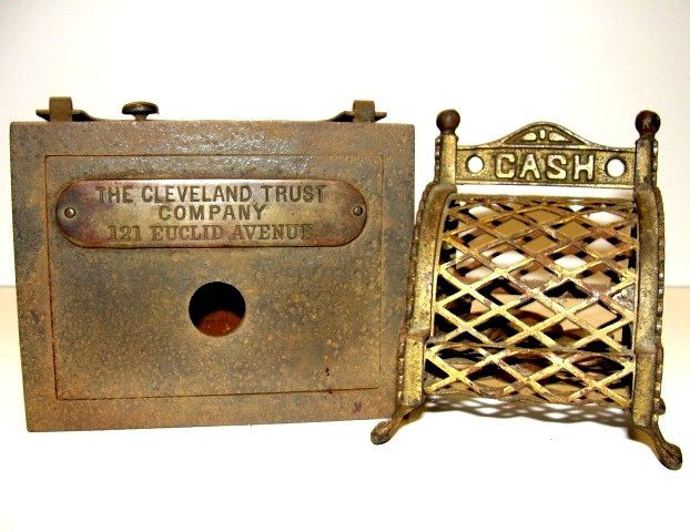 Two Vintage Cast Metal Still Banks: One box style from Cleveland Trust Bank Ca.1940, Light surface rust no key, All original little cast iron still bank made to resemble a cash register. Notice the word, 'CASH' marked across the top of