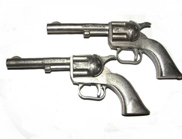 Pair Of Hubbley Cast Metal Toy Pistols: Condition very good. 5 1/2'' long.