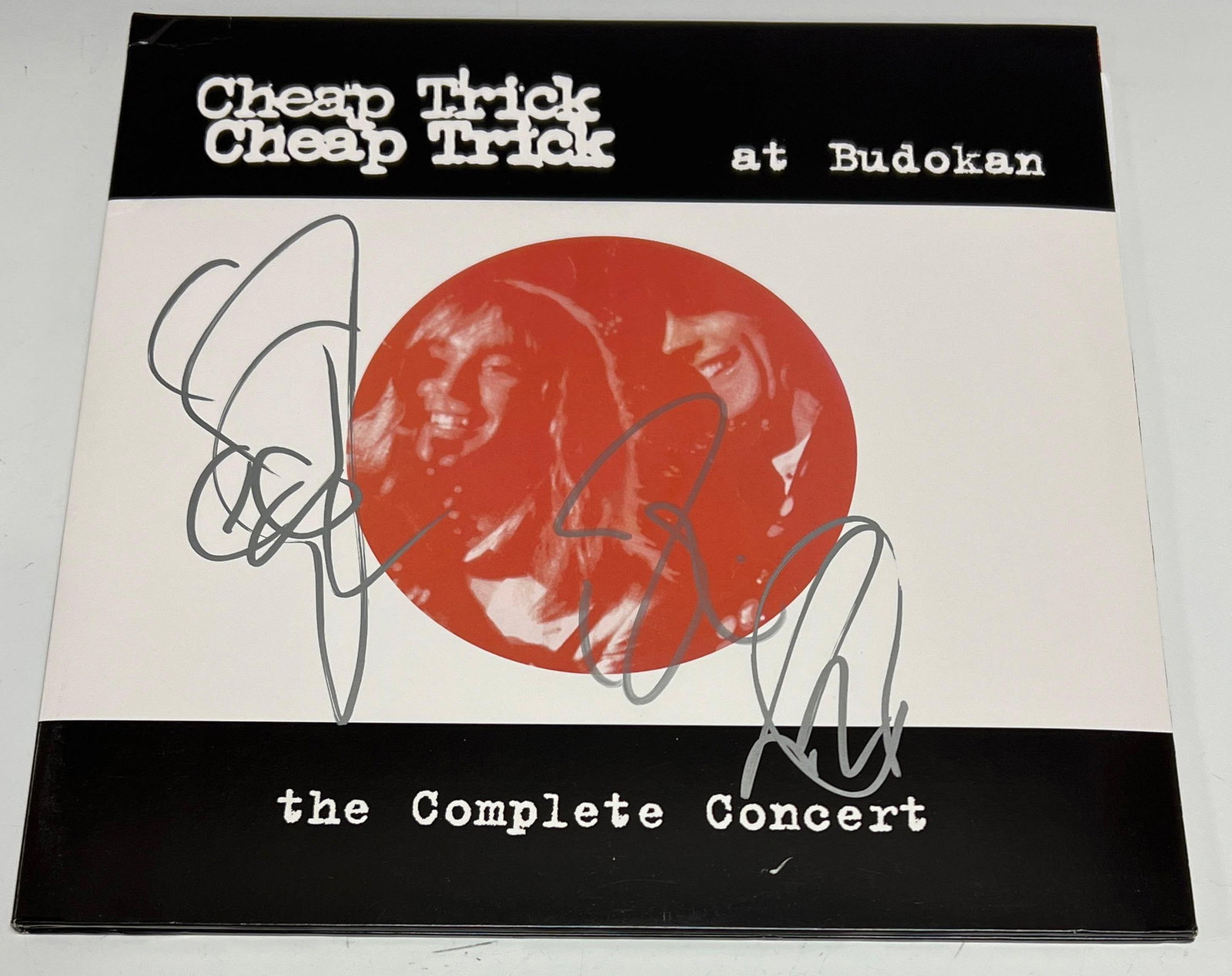 Cheap Trick Autographed Budokan Album Cover JSA: Silver signatures by three members of the iconic band; Robin Zander, Rick Nielsen and Tom Petersson. Hall of Fame members! 2016 album version. JSA LOA.