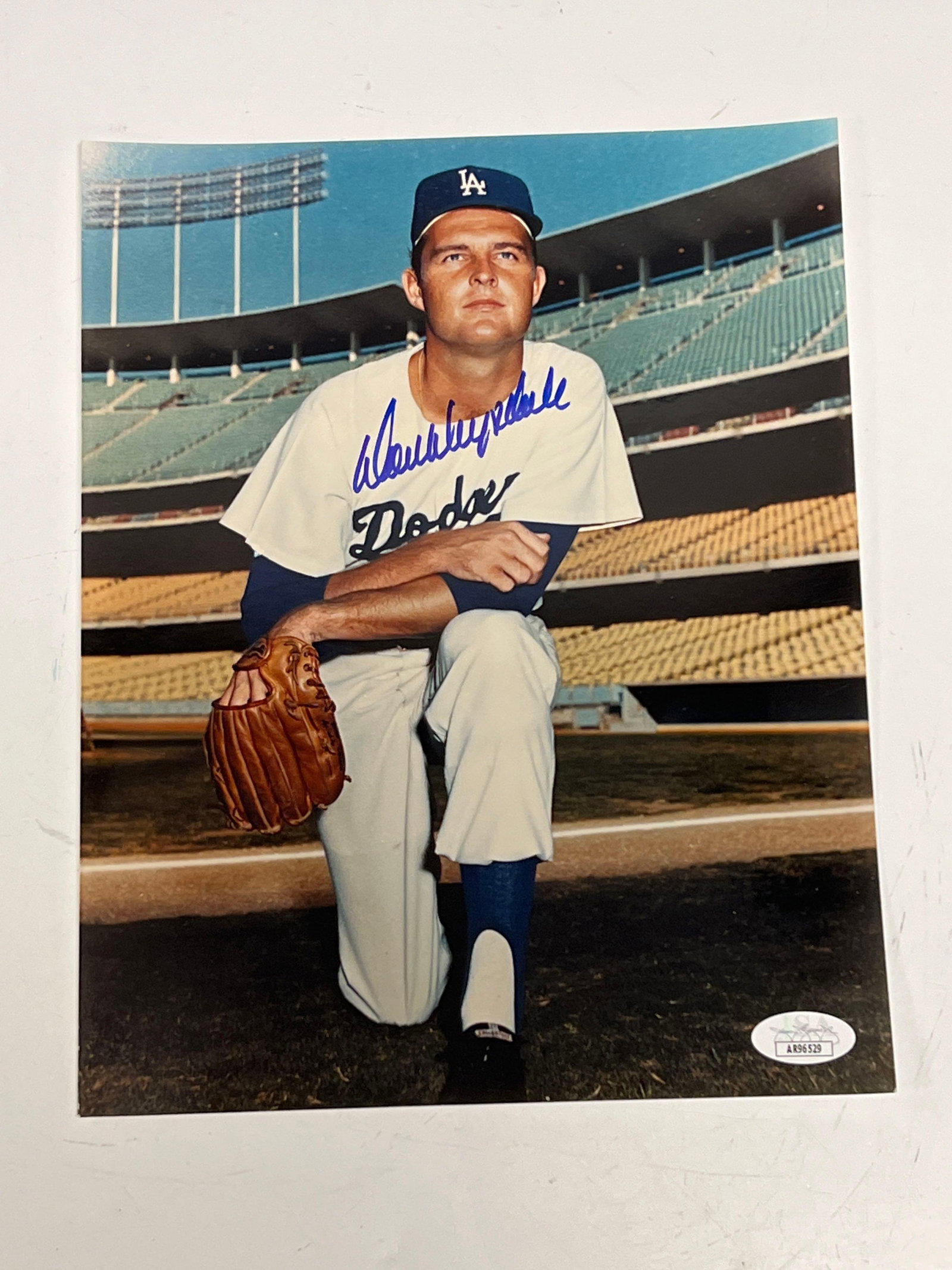Don Drysdale Autographed Color Photo JSA: 8x10 color photo of the LA Dodgers HOF pitcher posing in uniform. Blue marker signature ia a beauty! JSA certified
