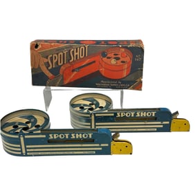 Two Wolverine Tin Litho Spot Shot Toys
