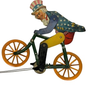 RARE Uncle Sam on Bicycle Tin Litho String Toy