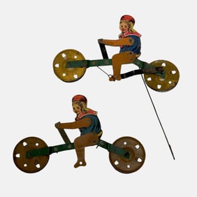 Two (2) Tin Litho Mechanical Gravity String Toys