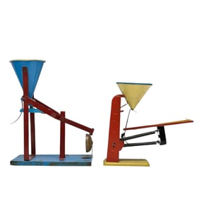 Two (2) Tin Litho Sand Mechanical Gravity Toys