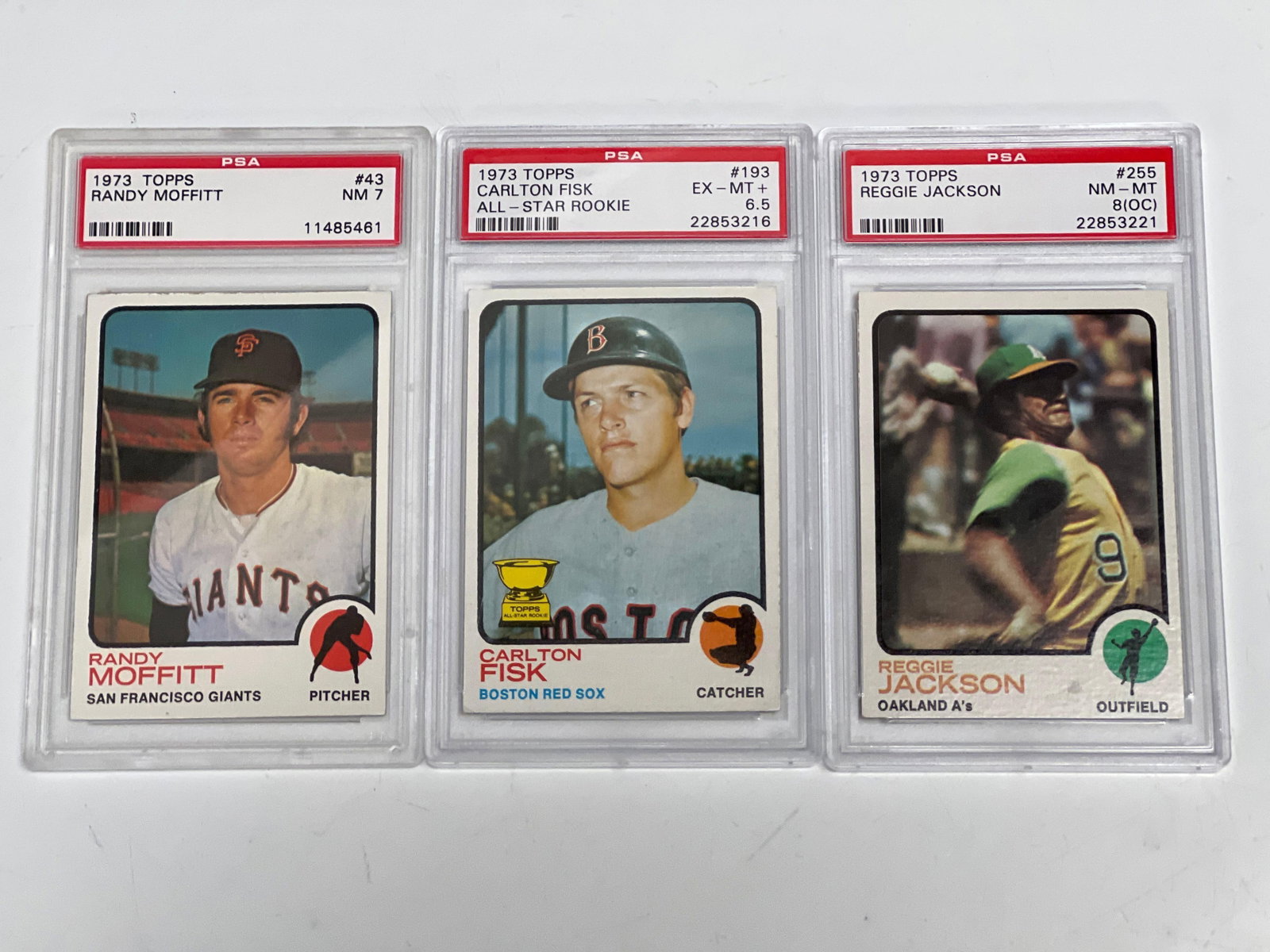 1973 Topps PSA Graded Reggie, Fisk and Moffitt: Any condition statement is given as a courtesy to a client, is only an opinion and should not be treated as a statement of fact. Premier Auction Galleries LLC shall have no responsibility for any erro