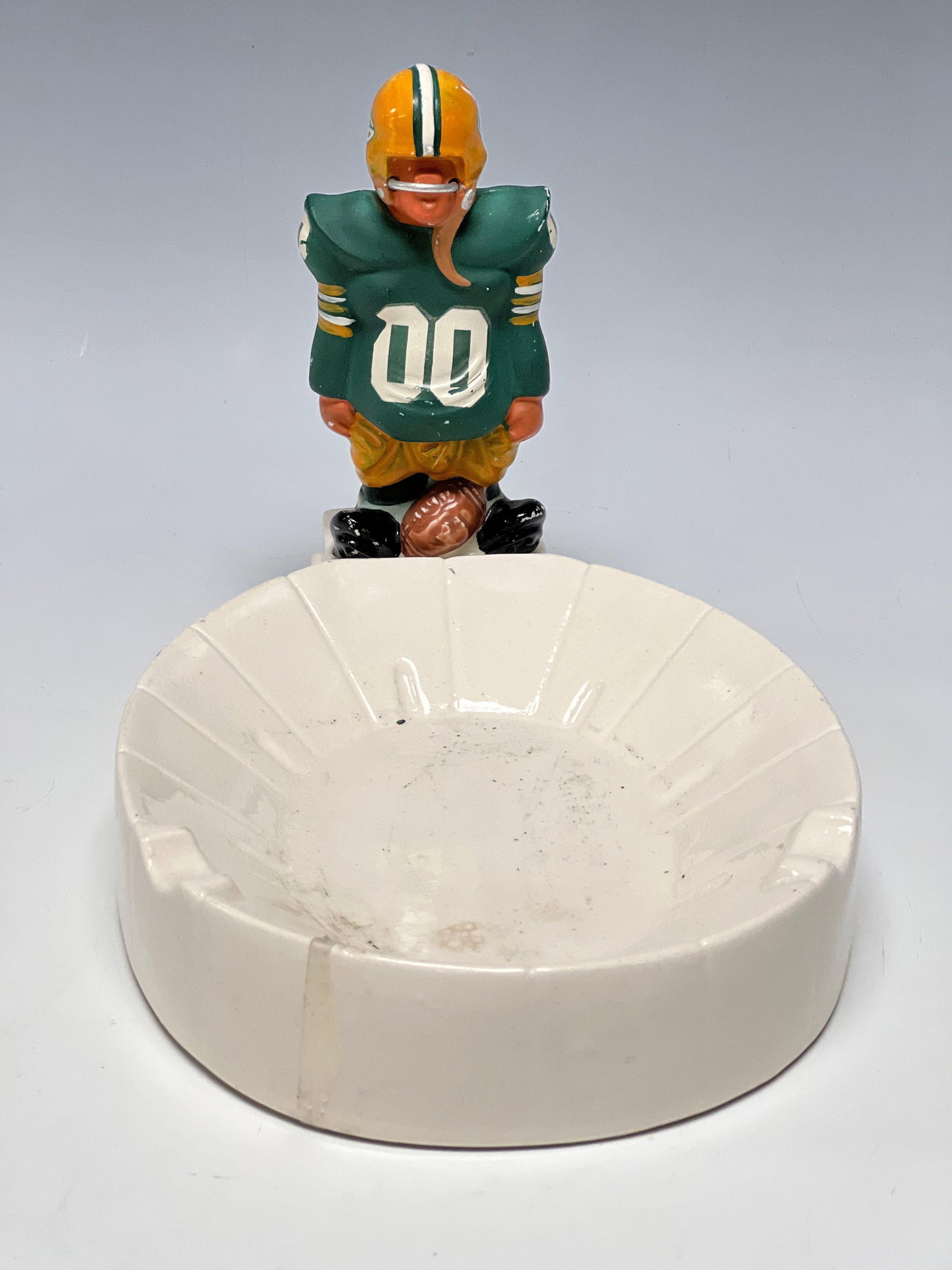 1960's Fred Kail FAK Green Bay Packers Stadium Ashtray: Any condition statement is given as a courtesy to a client, is only an opinion and should not be treated as a statement of fact. Premier Auction Galleries LLC shall have no responsibility for any erro