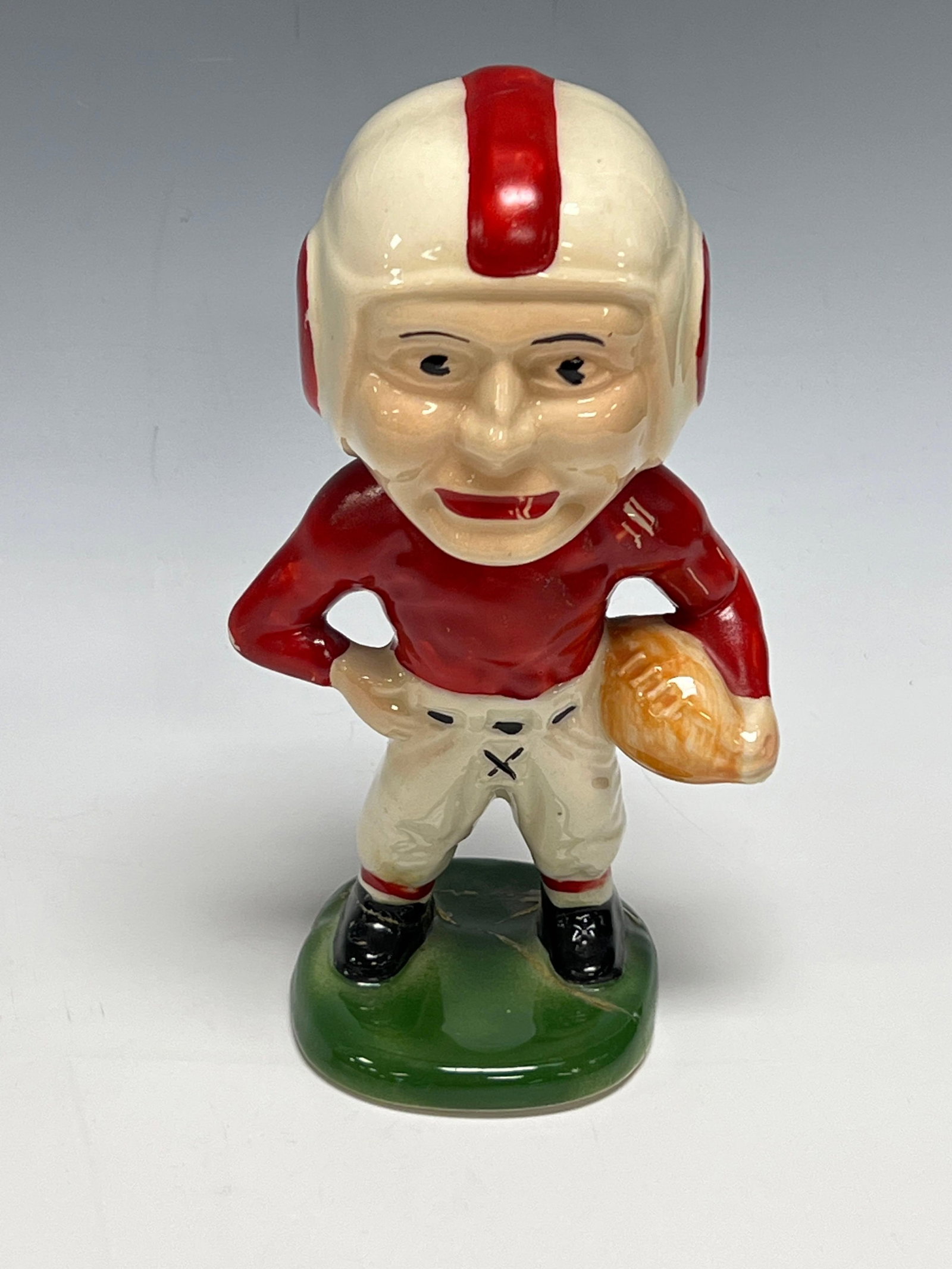1940's Ohio State Style Moyer Ceramic Football Player Bank (Damaged): Any condition statement is given as a courtesy to a client, is only an opinion and should not be treated as a statement of fact. Premier Auction Galleries LLC shall have no responsibility for any erro