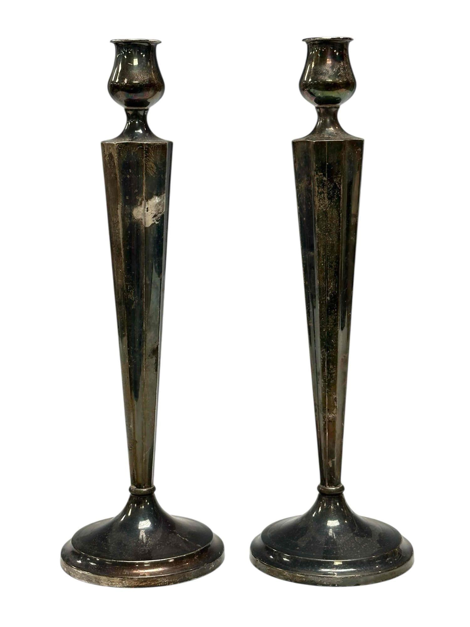 Pair of Arts and Crafts Sterling Silver Candle Sticks: Fine and elegant style pair of weighted sterling silver candle sticks. Approx 12" tall. Tarnish, need polished and a few dings, overall good as shown, see photos