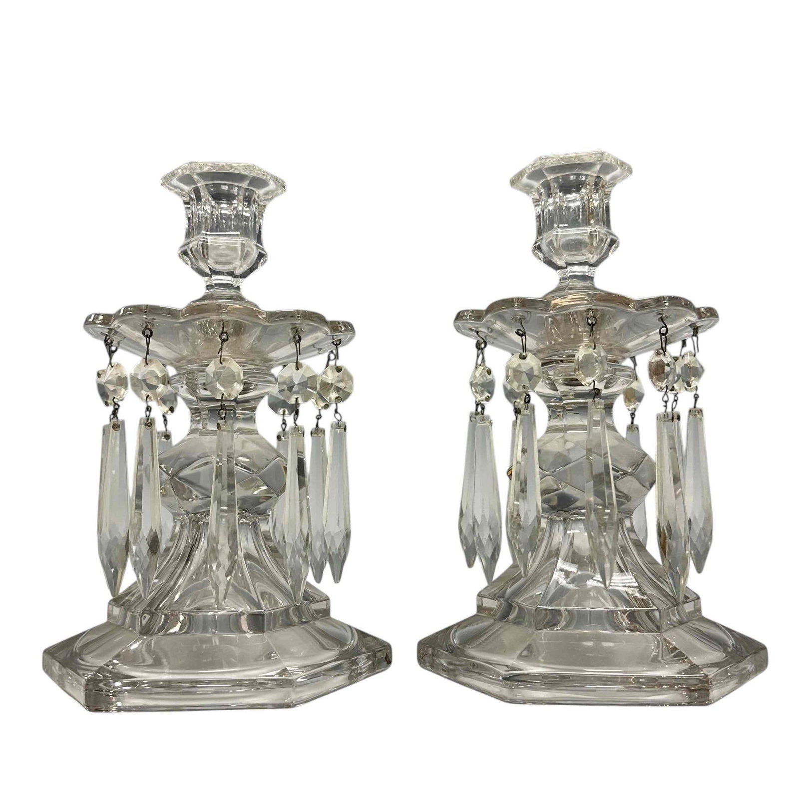Pair of Duncan Miller Glass Candle Sticks w Prisms: Single candle sticks with hexagonal bases and tear drop double hung prisms. Great for interior of elegance and class for you next dinner hosting event. Approx 9" tall. See photos, light use and wear c