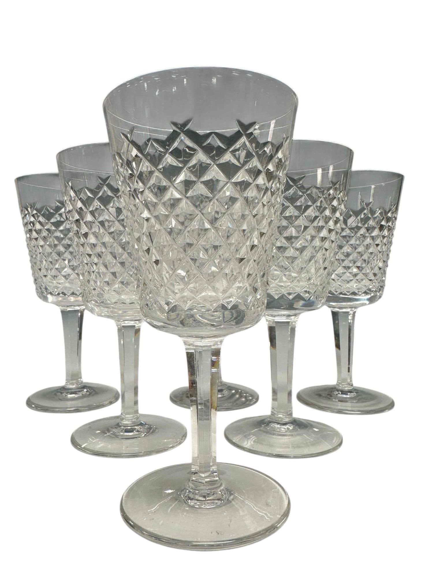 Set of (6) Waterford Alana Crystal Water Goblets: Waterford Alana Crystal water goblets. Criss cross cuts, plain foot. Etched mark. Measuring approx 7" height x 3.25 in. diameter at rim. All in good condition, light dust, see photos. Nice set to add