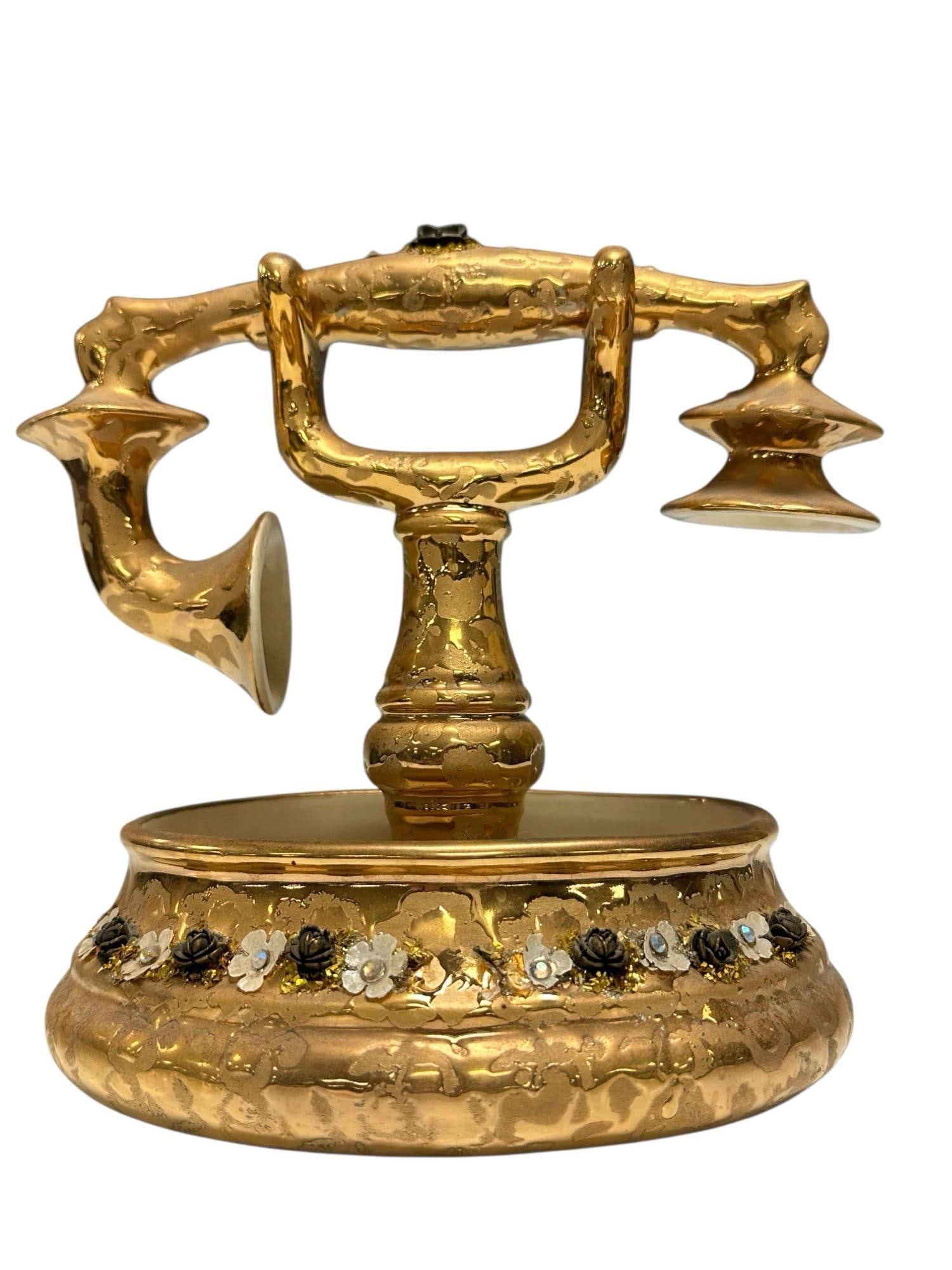 Decorative Gold Porcelain Stangl Phone for Essay: Antique modeled porcelain phone. Talk about a CONVERSATION piece...THIS IS IT. Measuring 8" tall x 9" wide. Good light use and wear as shown, see photos