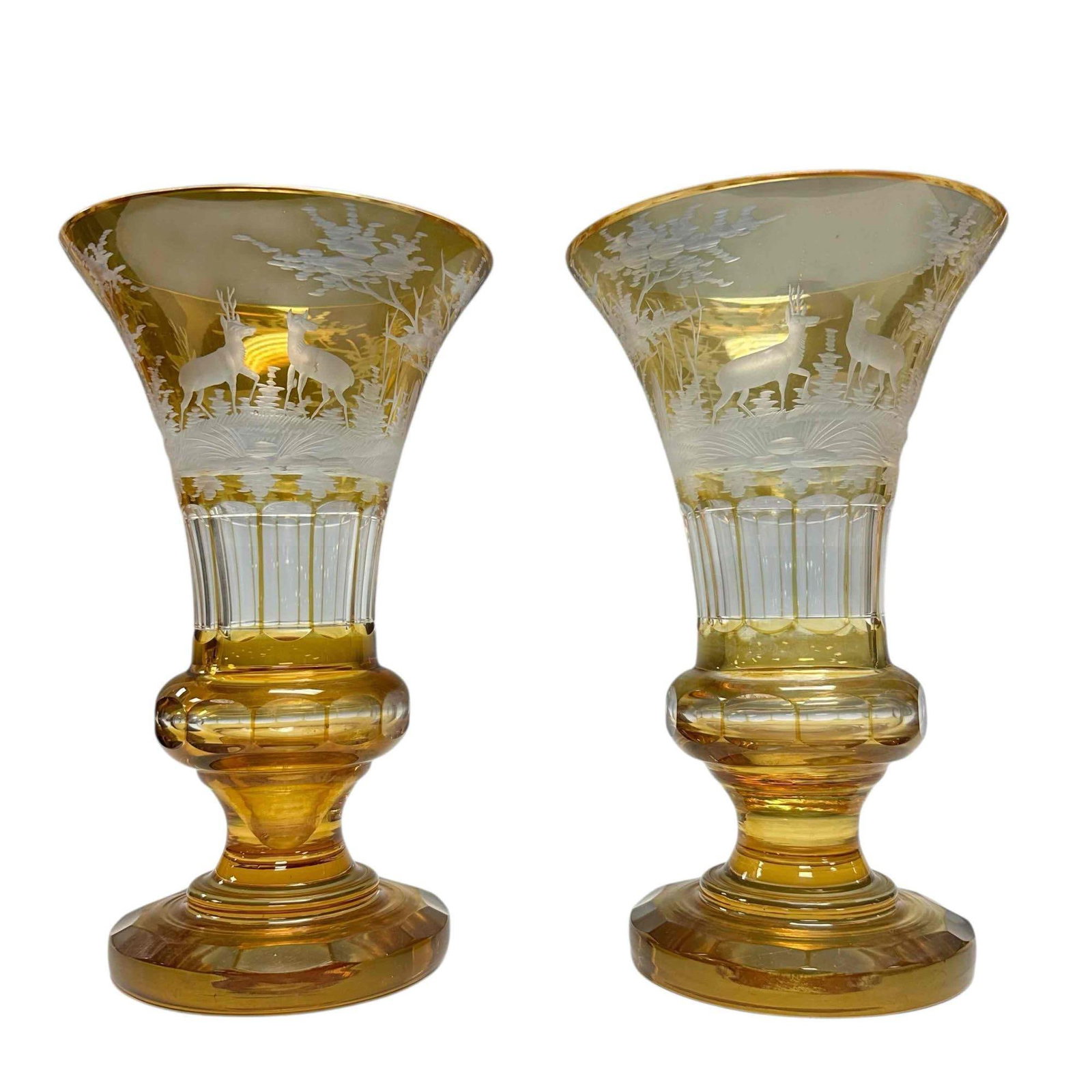A pair of Bohemian Czech Art Glass Vases: Etched and cut stag wildlife landscaped pedestal vases. Measuring approx 9" h x 5.5" diameter. Not one has two exterior rim nicks as shown, see photos