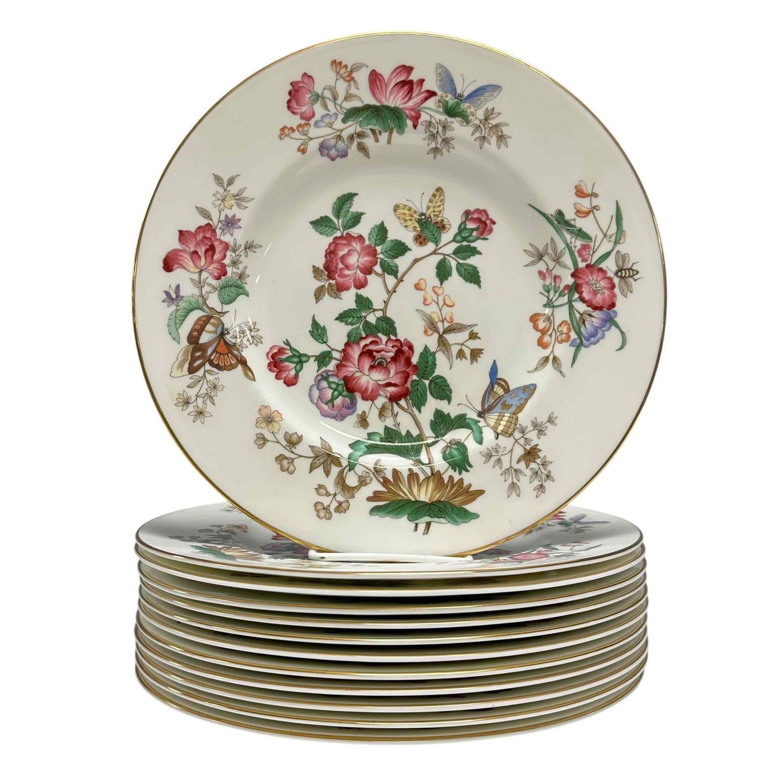 Twelve (12) Wedgewood Bone China Dinner Plates - Charnwood: Twelve bone China dinner plates by Wedgewood in the Charnwood pattern. Each plate measures approximately 10.5 inches in diameter. Decorated with a gold rim around the circumference and a floral patter