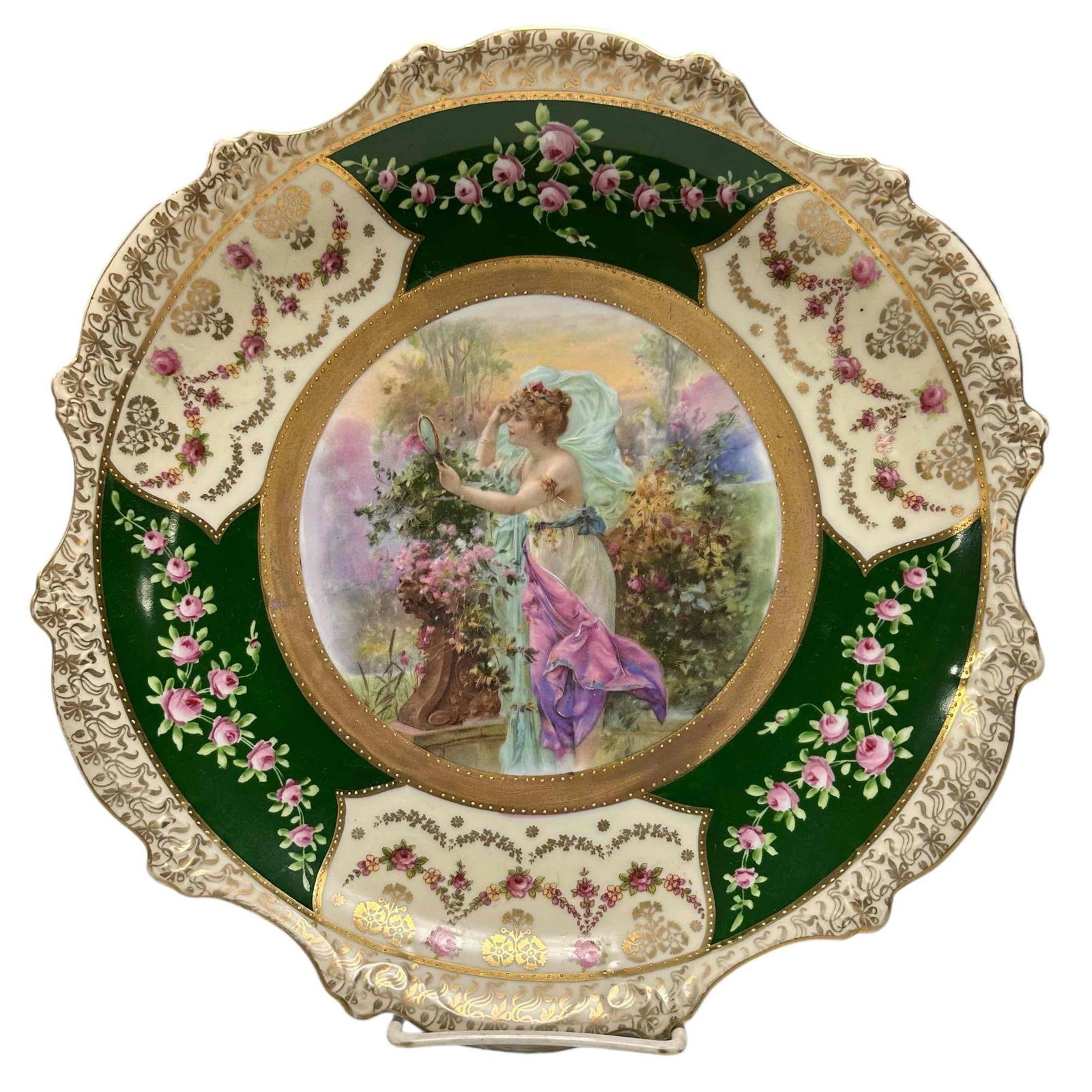 Austrian - Royal Vienna Cabinet Plate: The Mirror -Depicting elegant dressed 19th century woman in the garden gazing in a hand held mirror. Stamp on verso as shown. Measuring approx 12" dia. Overall very good as shown, hand embellished tra