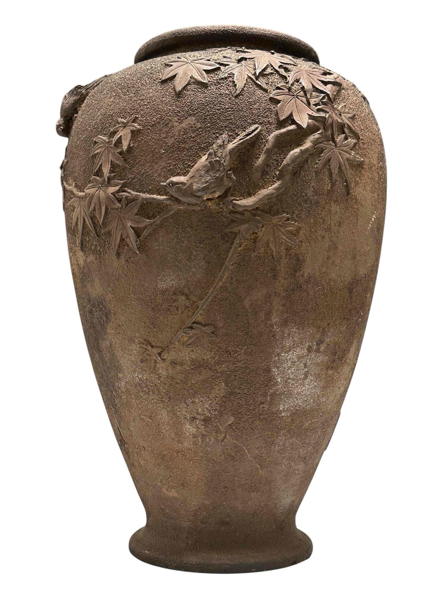 Japanese Meiji Cast Vase with Birds: Fine and detailed iron high relief vase with birds and foliage throughout. Stamped cartouche along lower base as shown. Measuring approx 16" h x 10" diameter. Bronze finish as shown, see photos