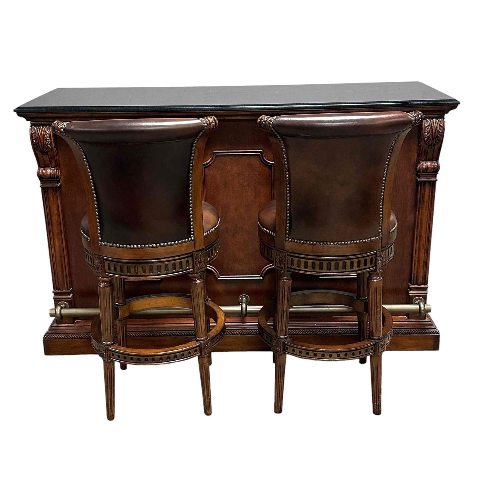A Fine 20th C. Howard Miller Wine and Spirits Cherry Wood Bar Set: Get ready for your holiday parties with the exceptional How Miller bar set including a black granite top with carved classical style cheery base, brass foot rail, interior fully fitted with trays, dra