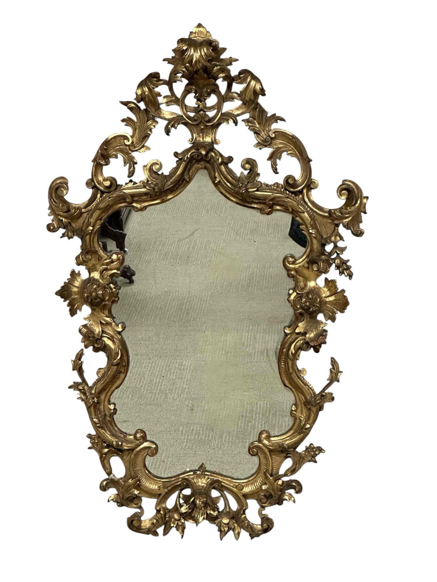 18th C. Italian Carved And Gilt Mirror: a fine 18th century carved gilt wood mirror. Measuring approx 41" h x 25" w. Some minor losses consistent with age, as shown, see photos