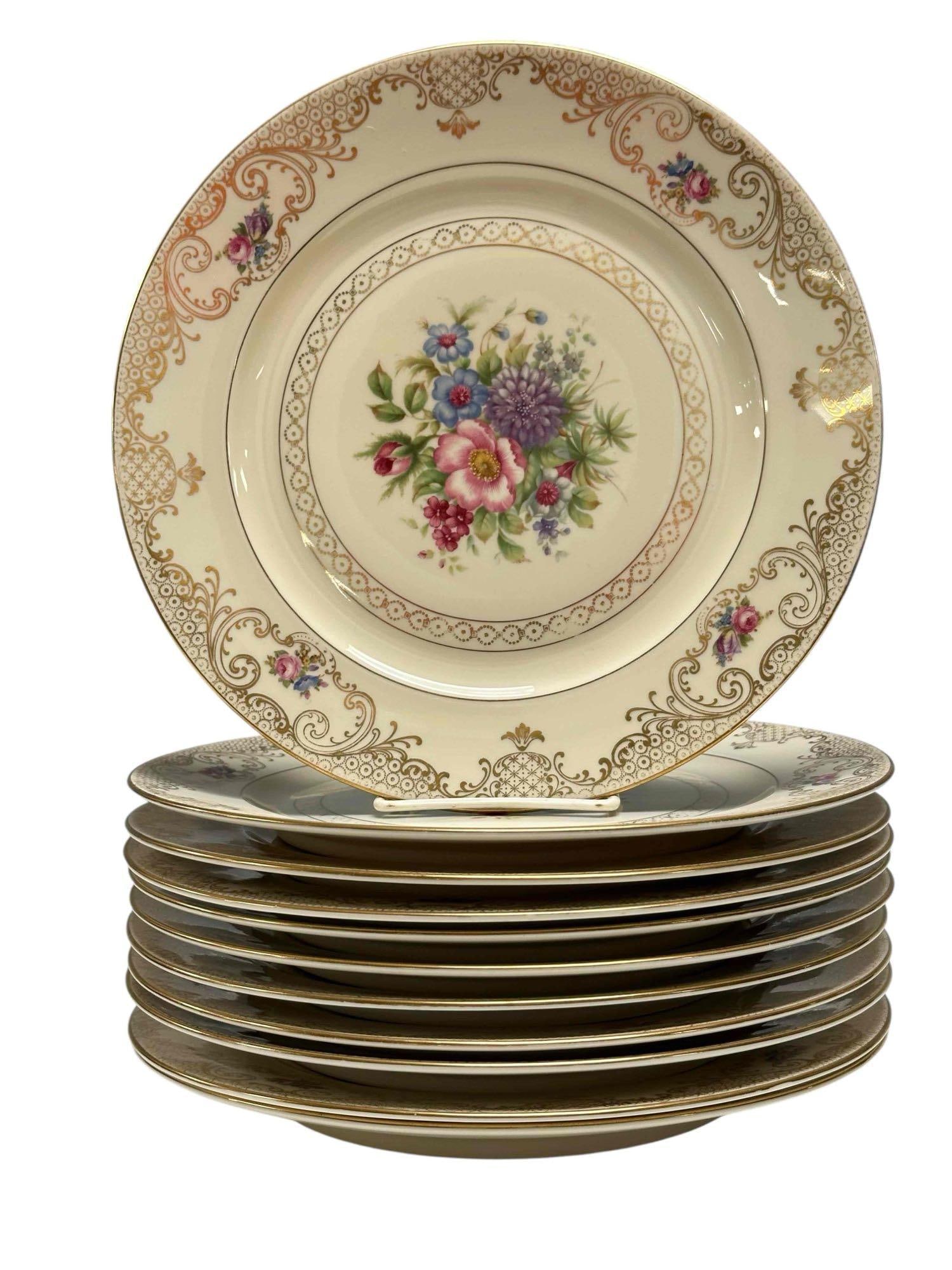 Bavarian Ivory Floral Dinner Plates Set of 11: Set of 11 floral with gold accenting dinner plates on Ivory backdrop. Measuring approx. 10.5" in diameter. In good condition with minimal to no utensil marks, some areas of gold fading and one having