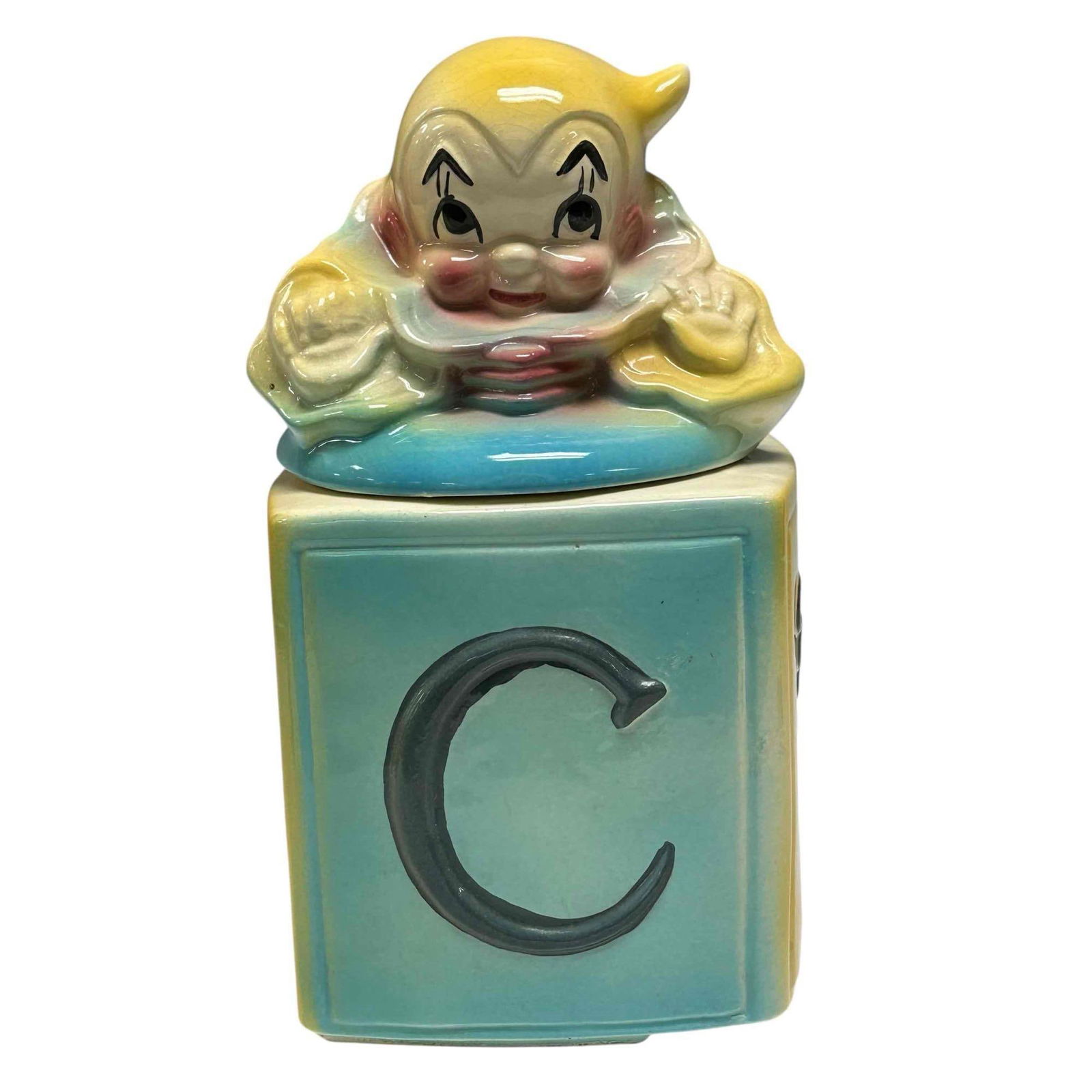 American Bisque Clown Jack in the Box Cookie Jar 1950's: American Bisque Clown Jack in the Box Cookie Jar 1950's. Age appropriate condition with no chips or cracks. Visible crazing on lid. Measures approx. 12" tall x 6" wide x 6" deep.