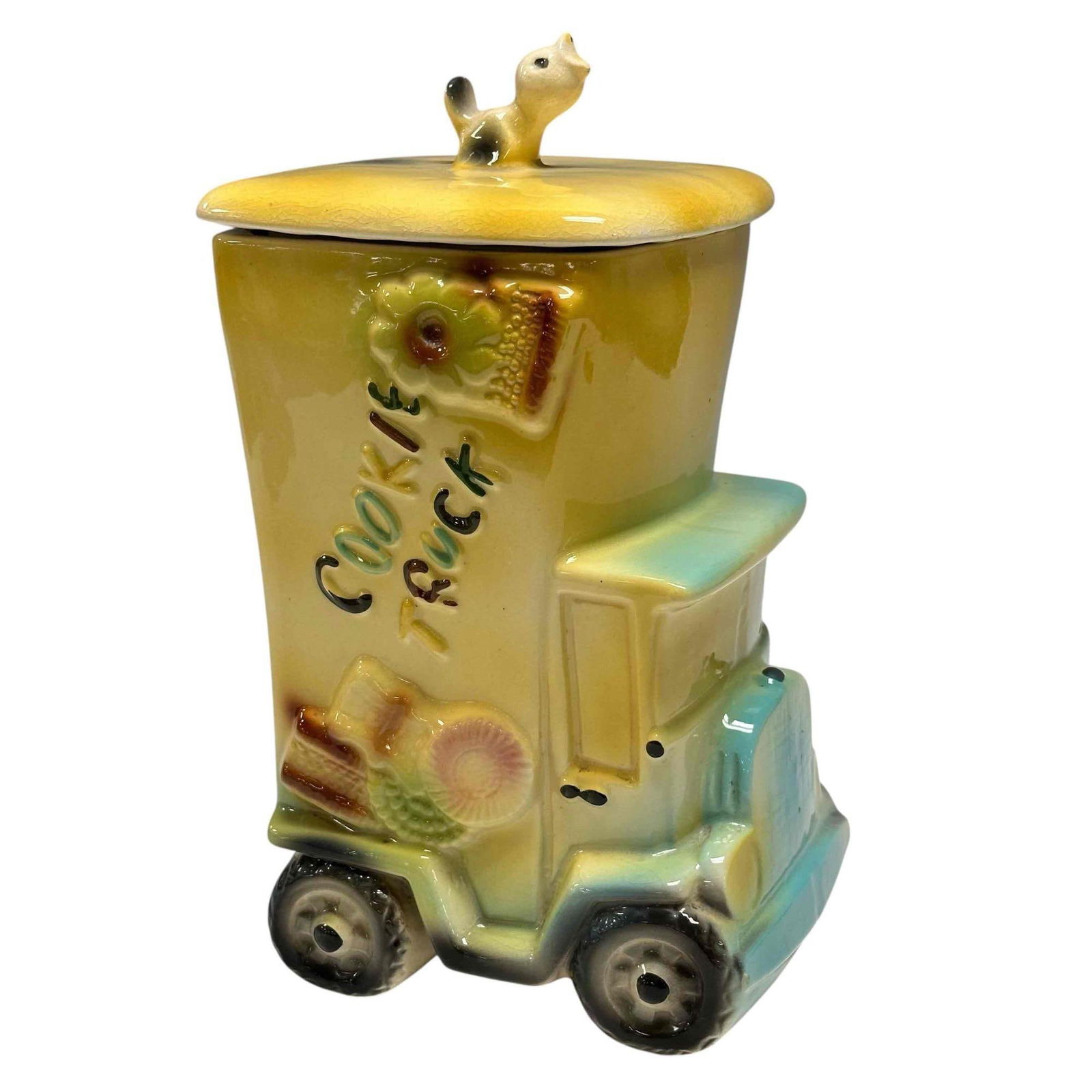American Bisque Cookie Truck Cookie Jar #744 USA 1940's: This American Bisque "Cookie Truck" cookie jar is super cute. Its a ceramic cookie jar shaped like a yellow truck with "Cookie Truck" embossed on the side, featuring a bird on the lid. Embossed USA #7