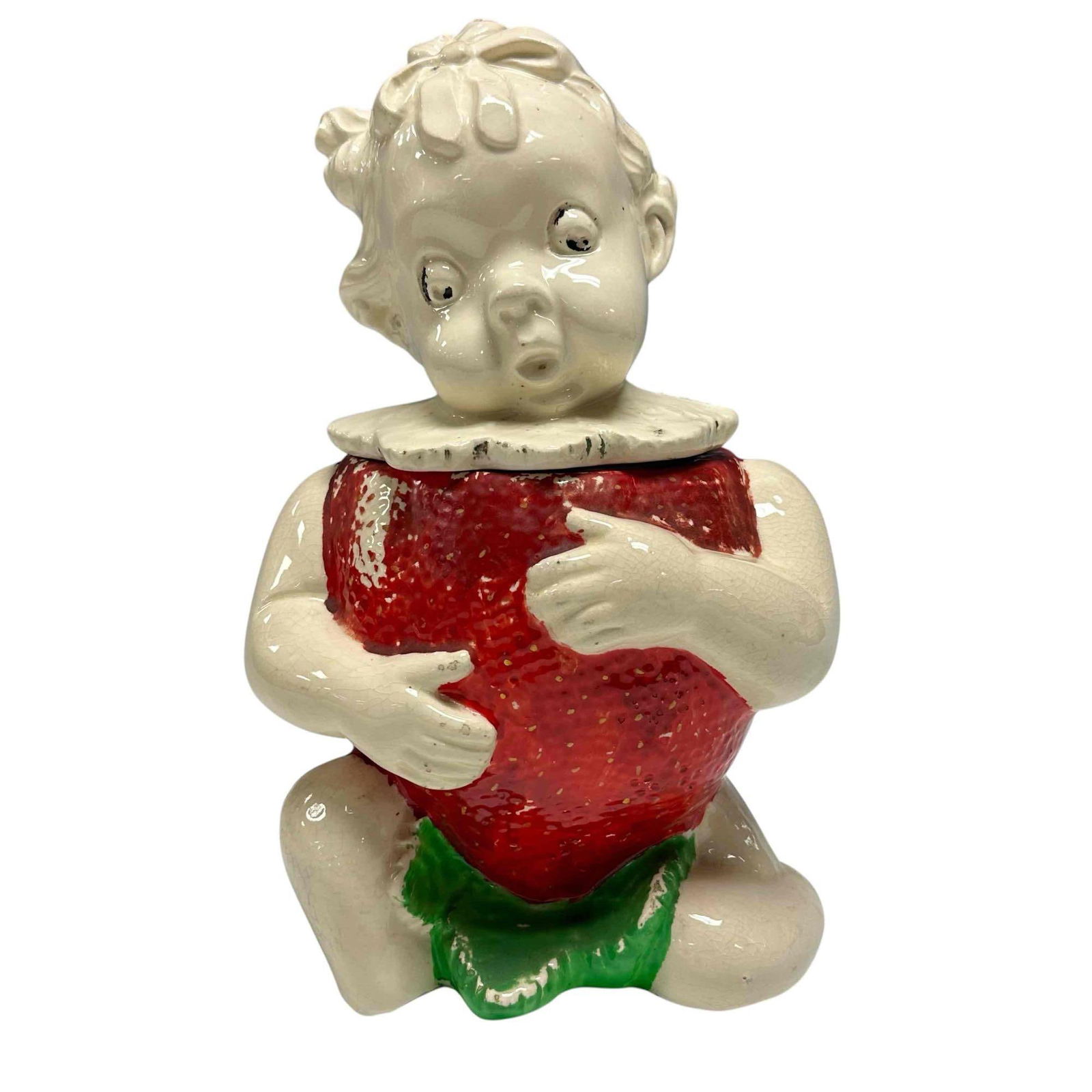 Stella Strawberry Cookie Jar 1940's: Stella Strawberry Cookie Jar featuring a baby or child figure cradling a large strawberry, which forms the main body of the jar. Made in the USA by the Pitman & Dreitzer Company (PD & Co) in t