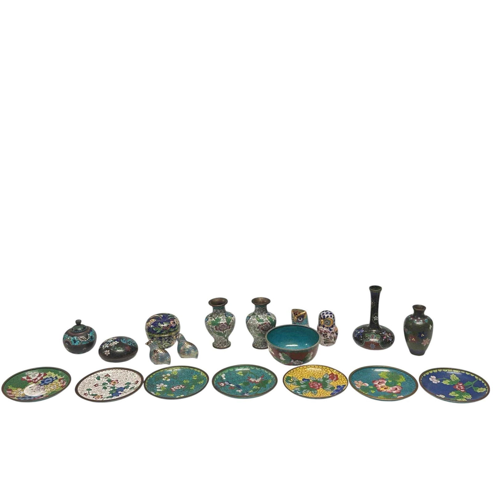 Chinese Miniature Cloisonne 20 Piece Collection: 20 pieces of Chinese cloisonne including; salt cellar, pill box, finger bowl, 7 floral saucers, bulbous vases, owls, birds, apple box and more. Measuring approx. 1" to 4" tall. All in age appropriate