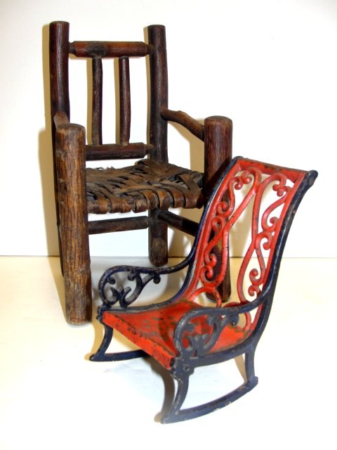 Miniature Cast Rocker Early Wood Twig Chair: Cast iron rocker, ca.1900 with short runners, or broken runners?, 5'' x 3'' x 4''. Early wood twig salesman sample chair with splint seat, ca. 1880's. Condition missing front stretcher, splint seat ha
