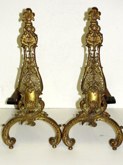 Very Ornate Cast Brass Fire Place Andirons: Ca. early 20th C. French style with pierced center section and rococo style crossed legs. With original cast iron dog legs attached. Condition very good. 21'' Tall 10'' Wide
