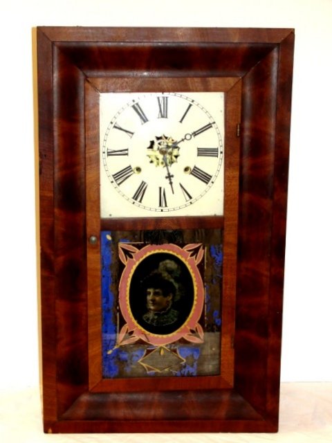 Waterbury Rosewood & Mahogany Shelf Clock: Ca.1870 30 hr. 8 day clock. The lower section with an eglomise panel of Gypsy type lady. Condition overall very good, wear and losses to paint on lower door section. Appears to work may need cleaning,