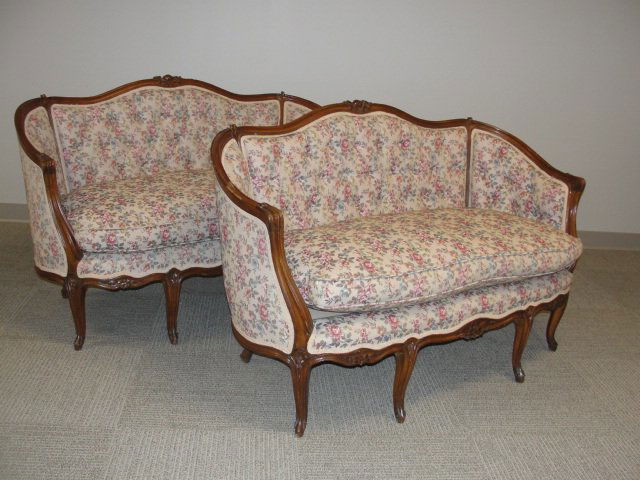 Pair Carved French XVI Style Settees Late 20th.C.: Matched pair with carved roses and floral print fabric. Condition very good, couple scuff marks on frames. h.32'' w.48'' d. 24''