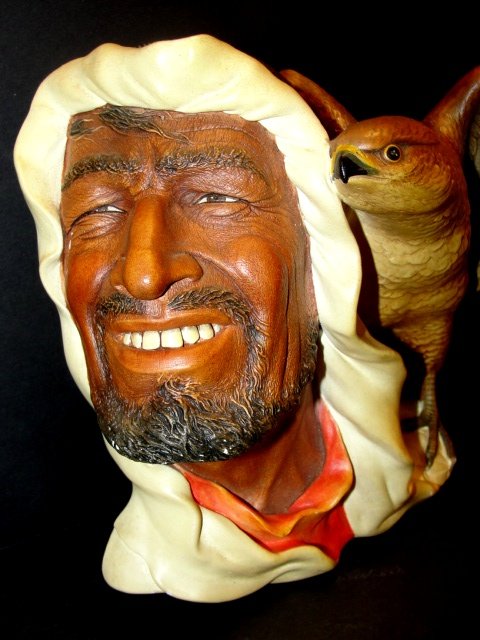Bossun Arab Falcon With Hunting Bird Plaque: Features an Arab man with a hunting falcon on his shoulder. Amazing vintage 3-D design. Beautiful colors to complete the mid century style. Each measures 7" tall x 7" wide