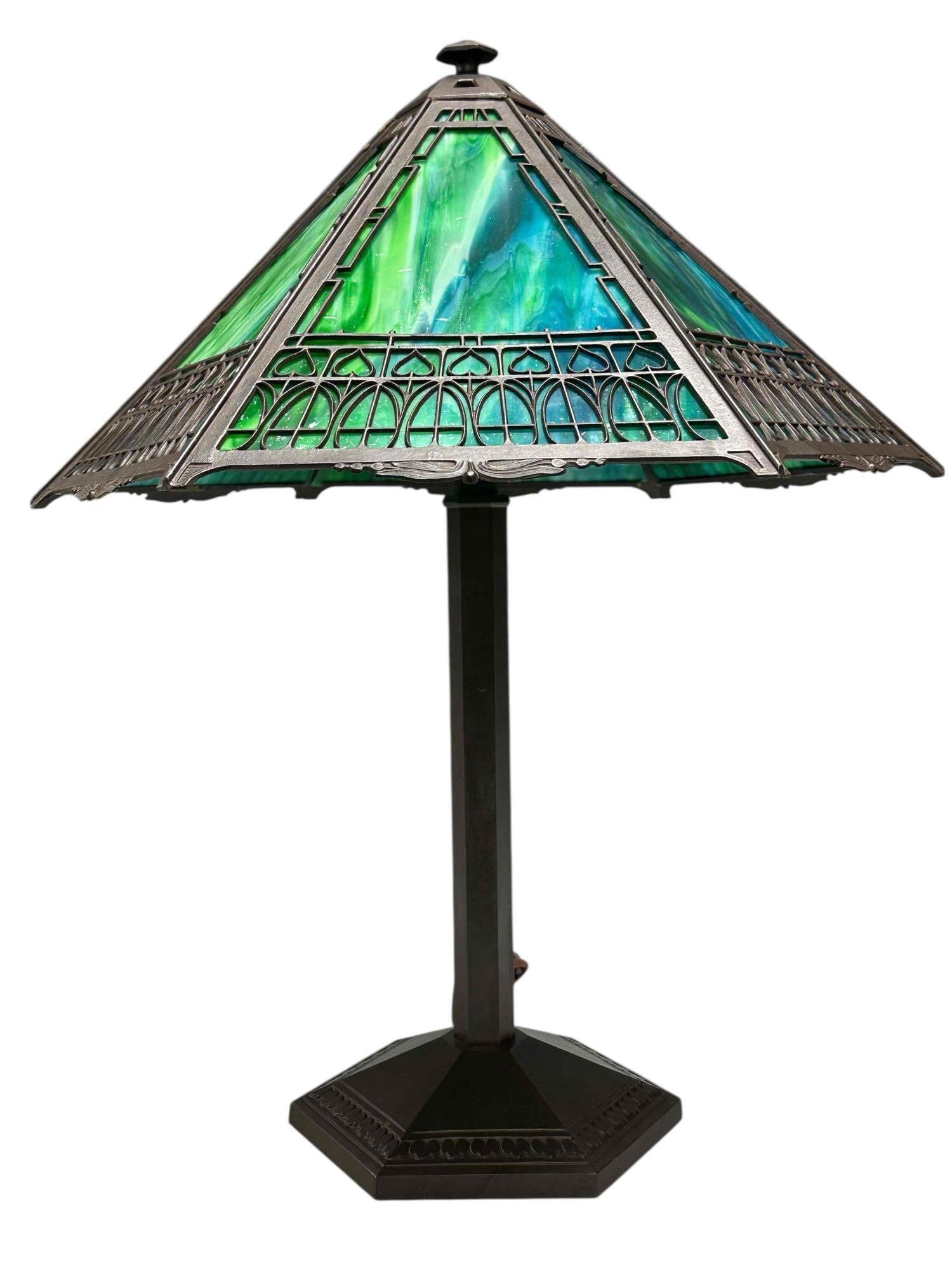 Impressive Bradley and Hubbard Green and Blues Slag Panel Lamp: American, Bradley and Hubbard slag glass panel lamp with oceanic blue and green hues slag glass panel lamp with overlay with heart tulip motif as shown. Measuring approx 25" tall x 18" x 18". Good wor