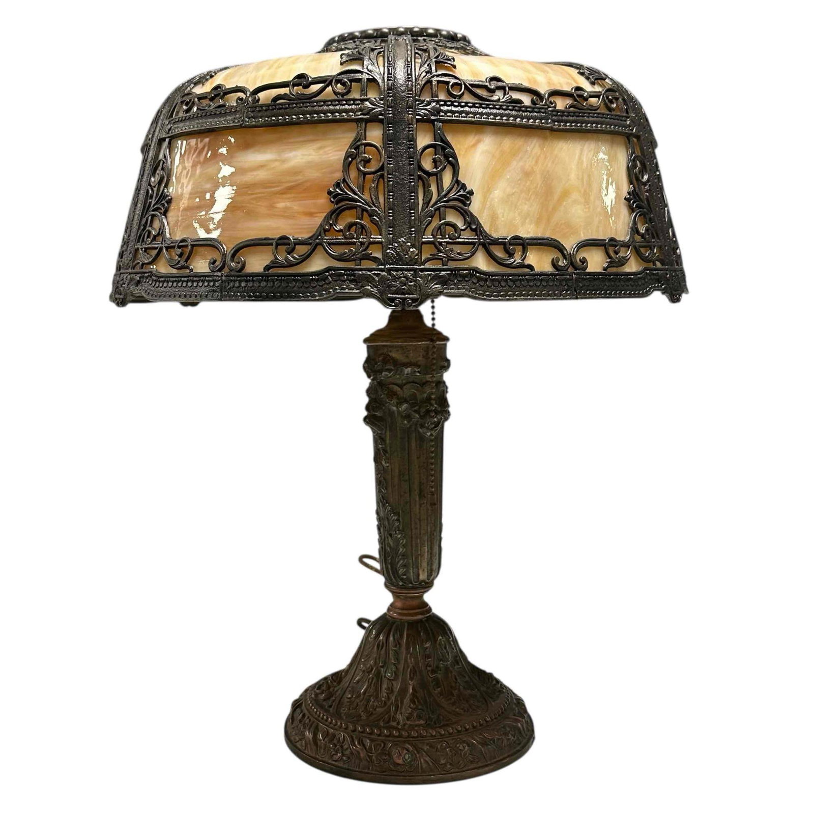 Art Nouveau Slag Lamp with Filigree Metal Overlay: Early 20th century American slag glass panel lamp with metal overlay scroll work seated on an extremely ornate patinated bronze base. Likely Edward Miller & Co. Measuring approx 20" h x 16" diamet