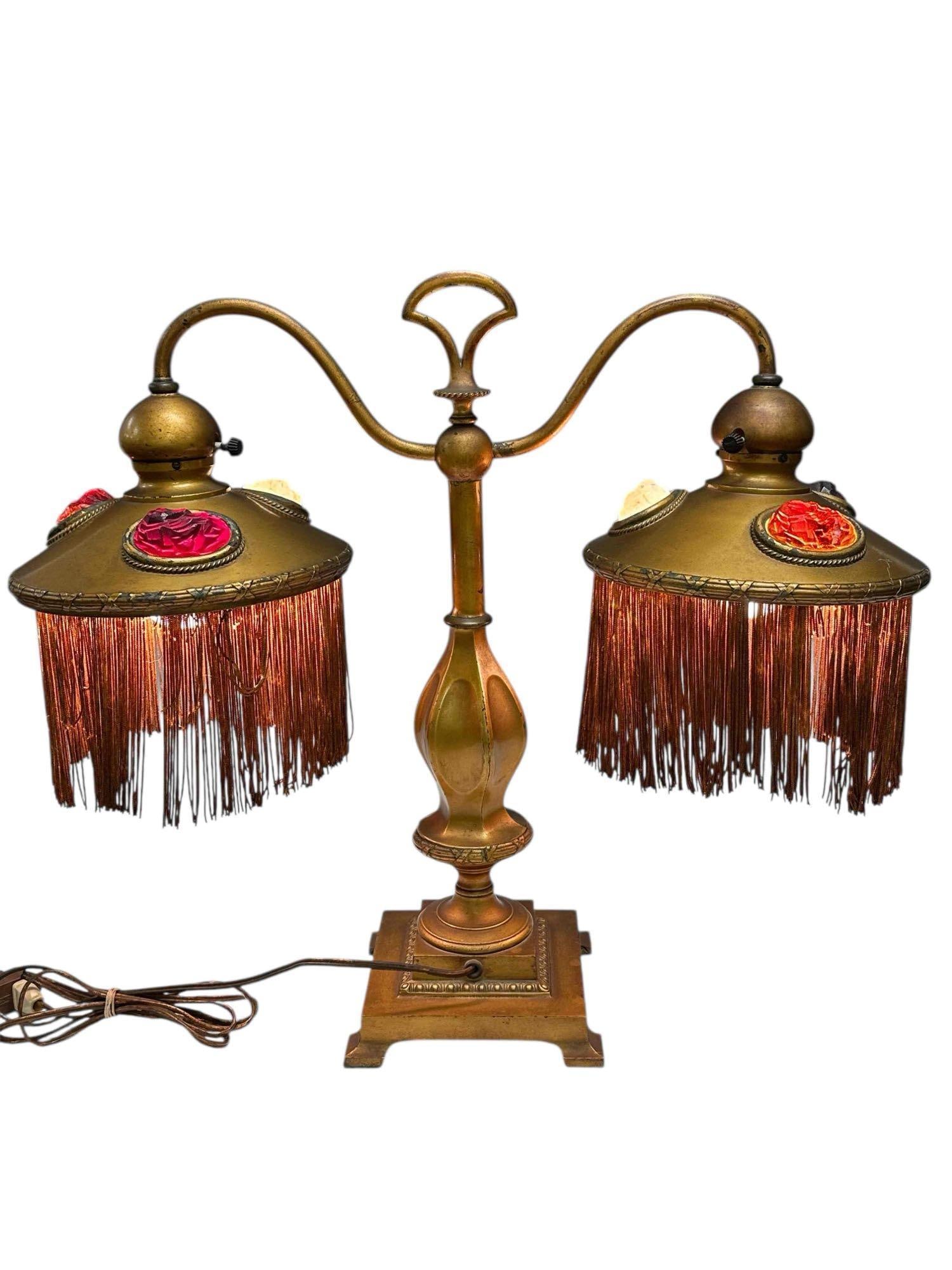 Bradley and Hubbard Double Student Lamp with Chunk Jewels: An early 20th century, American double student lamp by Bradley and Hubbard. The two-arm lamp base is finished in gold dore. Potentially used as bankers desk lamp for customers. Each of the two lamps i