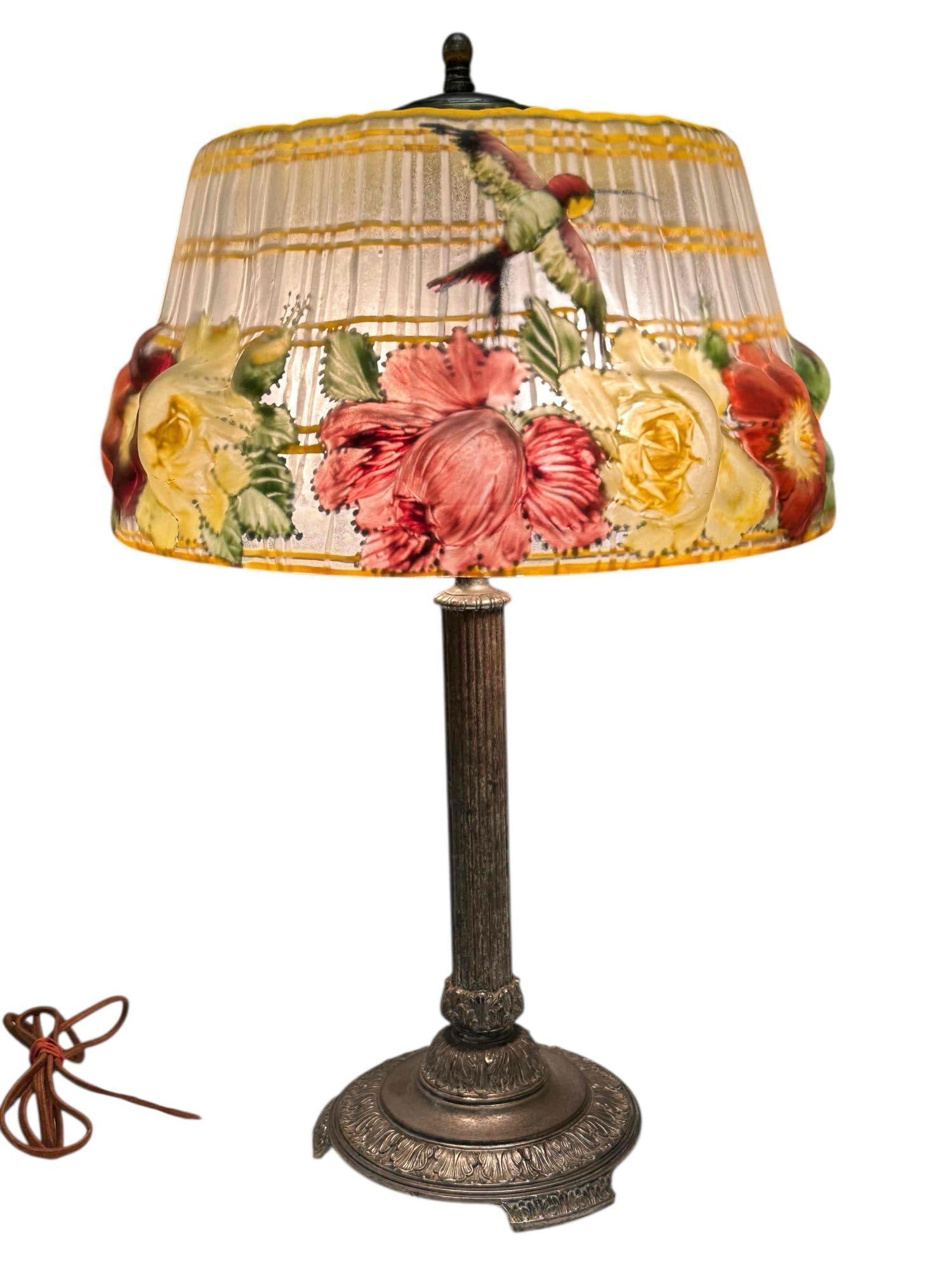 Pairpoint Puffy Reverse Painted Hummingbird Lamp: New Bedford, MA, early 20th century; the "Devonshire" shade reverse-painted with red, yellow, and white roses and a hummingbirds. The Devonshire shade is a "semi-puffy" design, meaning it is partially